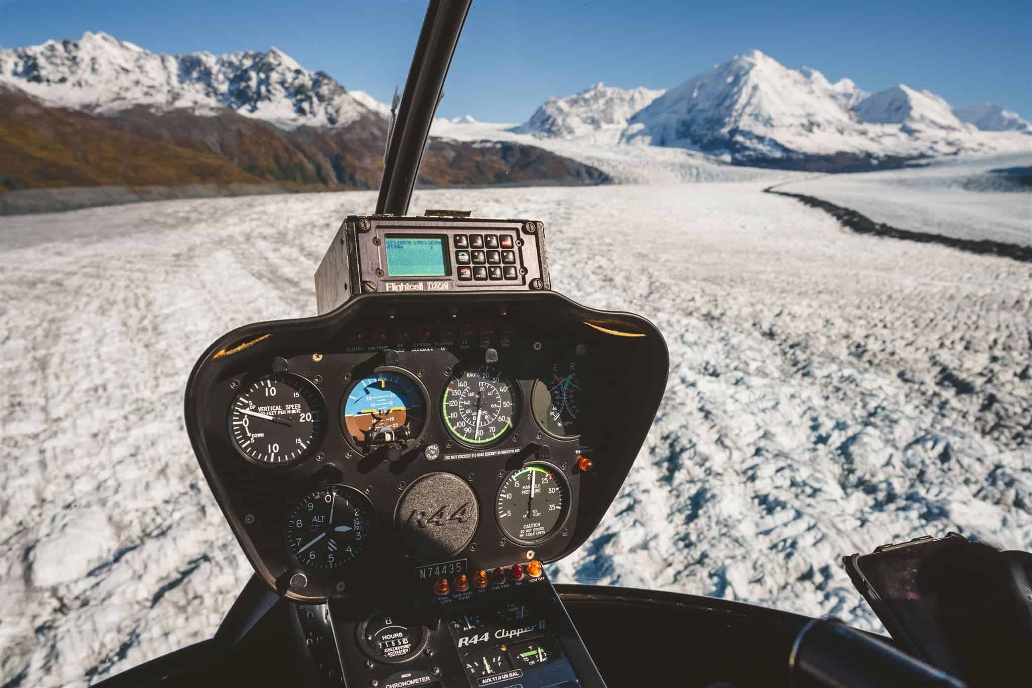 view from inside helicopter flying up the Knik Glacier
